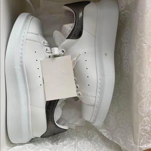 Selling my authentic Alexander MCqueen white  sneaker. Bought it from ssense.